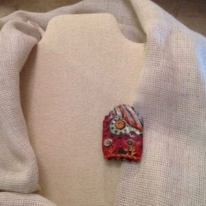 House with flowers broach